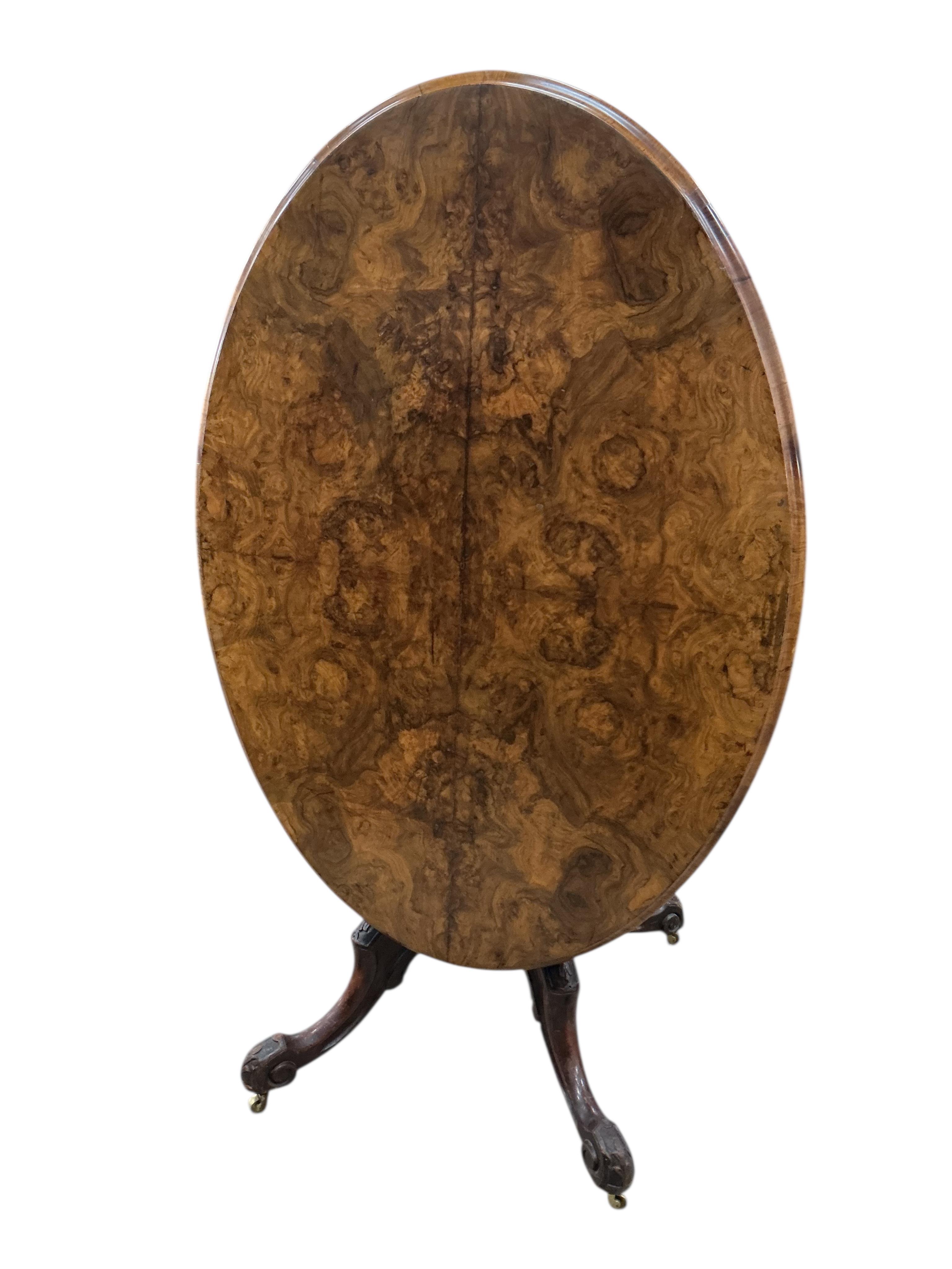 A Victorian figured walnut oval tilt top loo table, width 84cm, depth 122cm, height 72cm